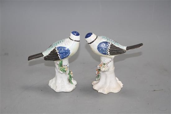 A pair of Derby figures of blue tits on tree stumps, c.1765-70, height 11.7cm and 11.5cm